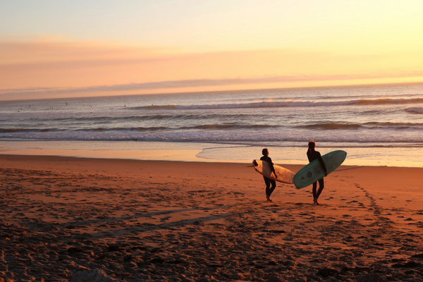 Surfers at sunset on our Australia program