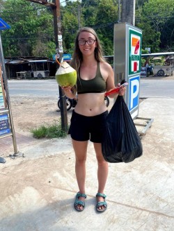 Tanner completes 2 tasks at once: beach cleanup and getting a coconut.