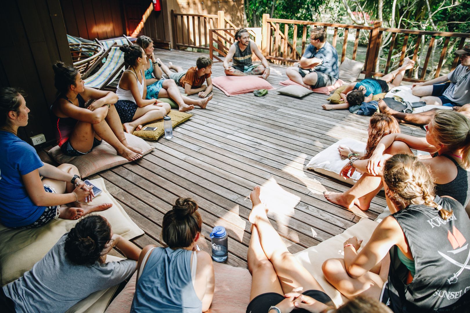 Students smiling around yoga circle